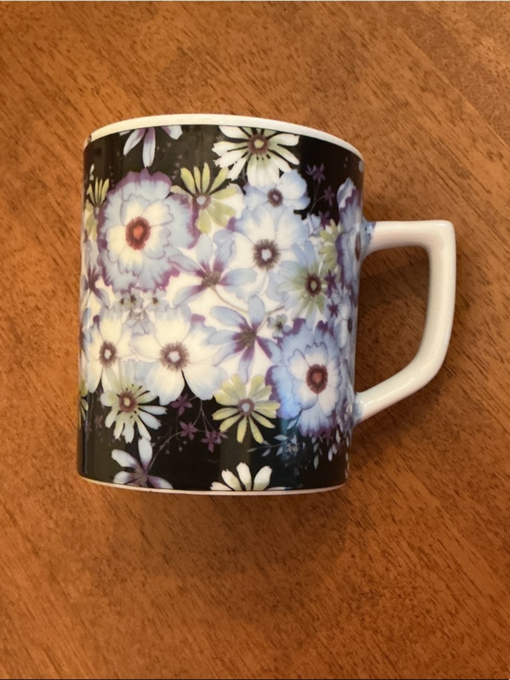 Barnes & Noble Black Mug with blue and White Floral Pattern